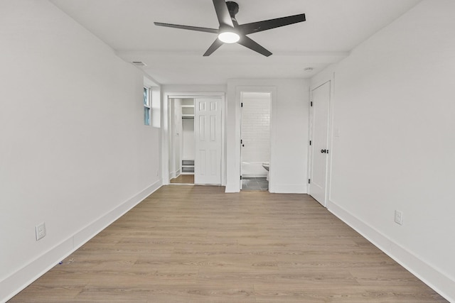 interior space featuring light wood-type flooring and ceiling fan