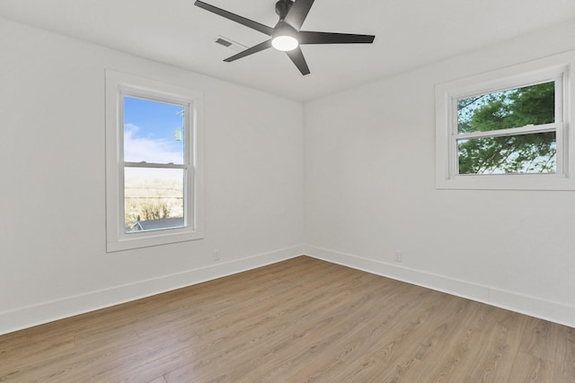 spare room featuring light wood-type flooring and ceiling fan