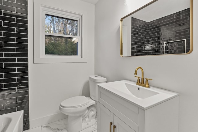 bathroom featuring toilet and vanity