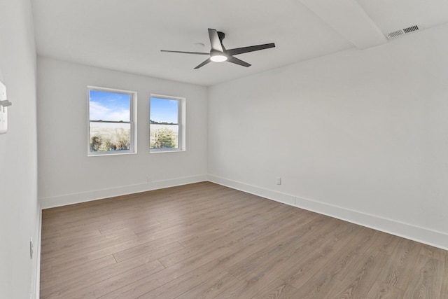 spare room with ceiling fan and light wood-type flooring