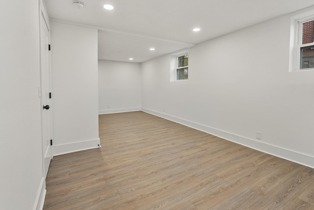 basement featuring light hardwood / wood-style flooring