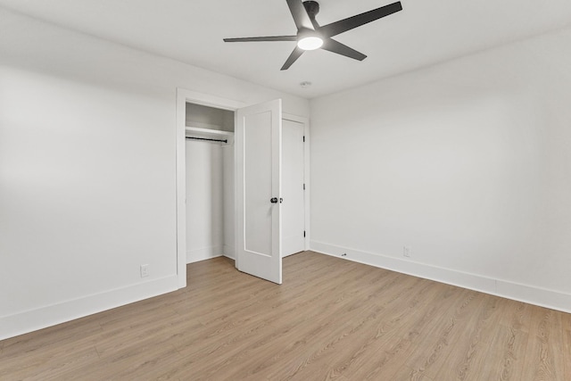 unfurnished bedroom with ceiling fan, a closet, and light hardwood / wood-style floors