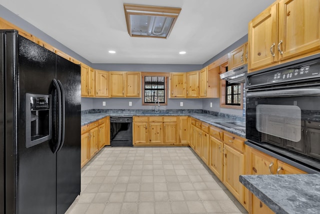 kitchen with light brown cabinetry, range hood, sink, and black appliances