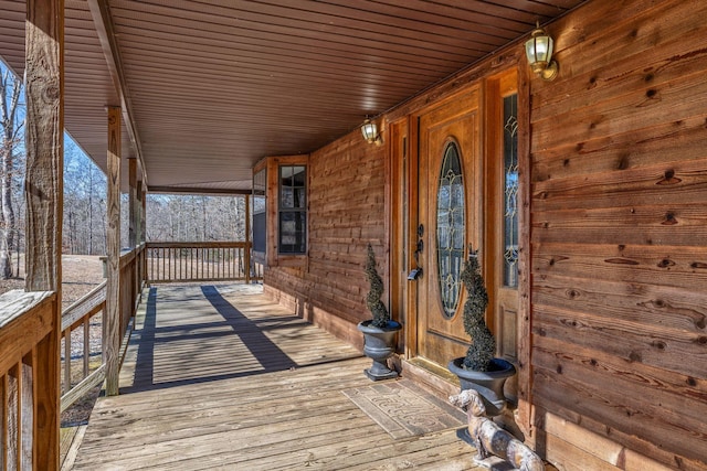 wooden terrace with a porch