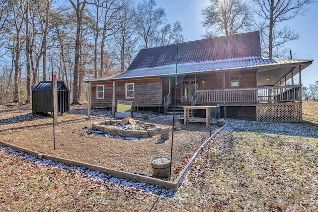 rear view of property with a porch