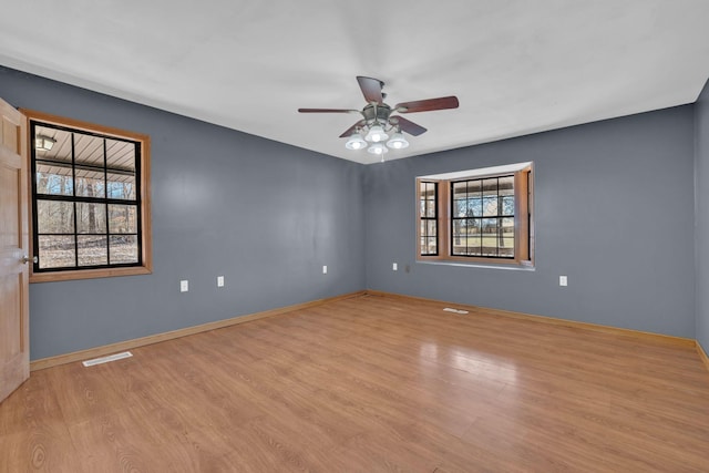 unfurnished room featuring ceiling fan and light hardwood / wood-style floors