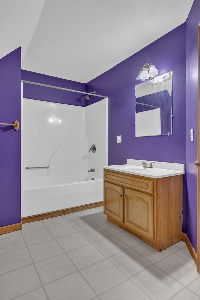 bathroom with shower / bathing tub combination, vanity, and tile patterned flooring