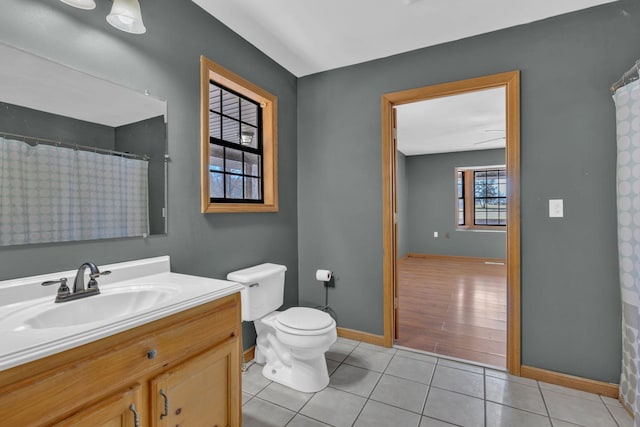 bathroom featuring tile patterned floors, toilet, and vanity