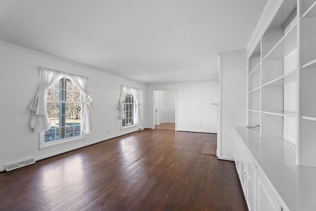 unfurnished living room featuring crown molding and dark hardwood / wood-style floors