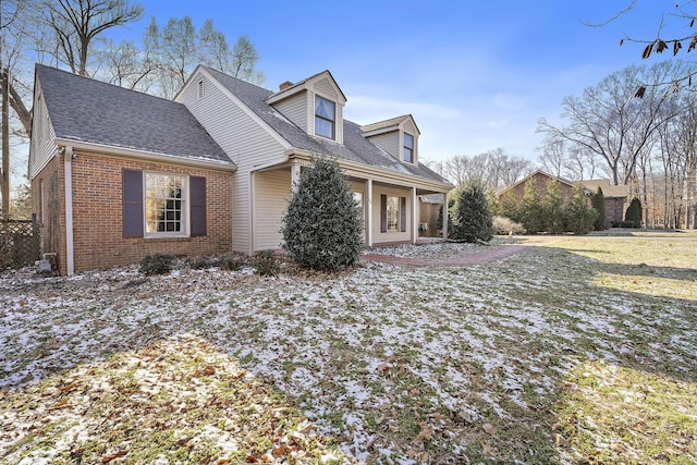 view of side of home featuring a lawn