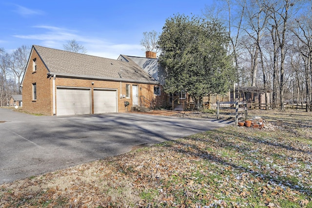 exterior space with a garage