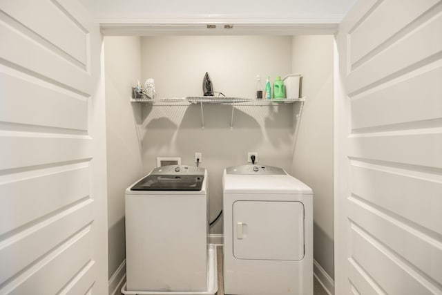 laundry room featuring washing machine and clothes dryer