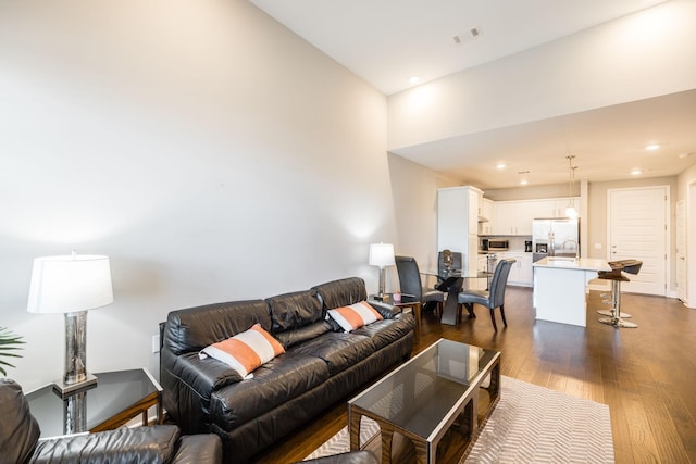 living room with dark hardwood / wood-style floors