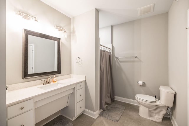 bathroom with toilet, a shower with curtain, tile patterned floors, and vanity