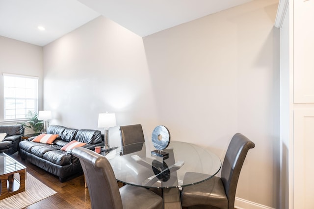 dining space featuring dark wood-type flooring