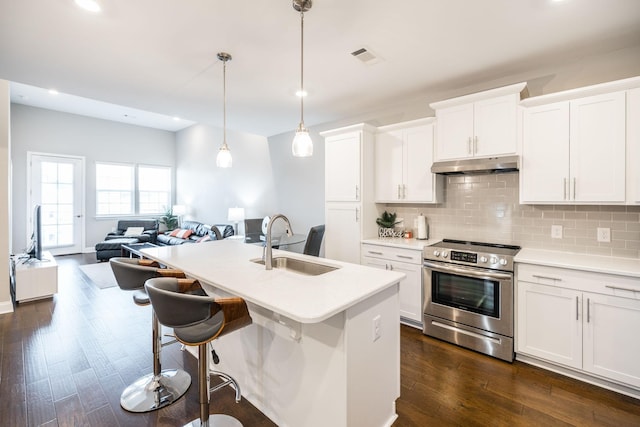 kitchen featuring pendant lighting, white cabinets, and stainless steel electric range oven