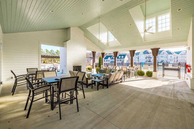 view of patio / terrace featuring an outdoor brick fireplace