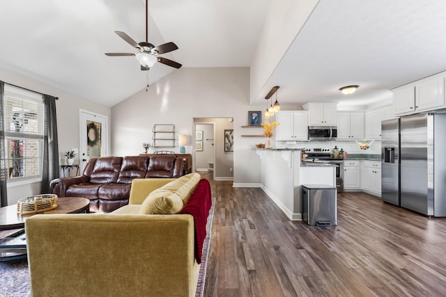 living room with ceiling fan, high vaulted ceiling, and dark hardwood / wood-style flooring