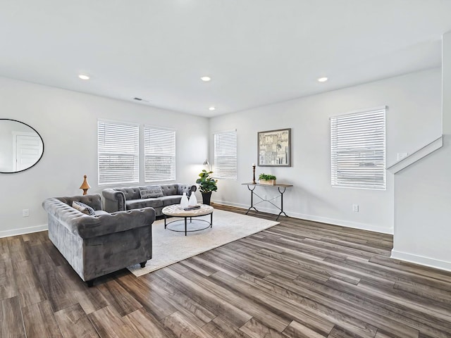 living room with dark hardwood / wood-style flooring