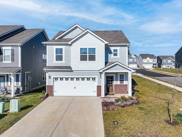 view of front of property featuring a garage and a front yard