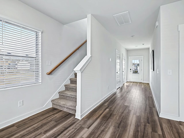 foyer entrance with dark wood-type flooring