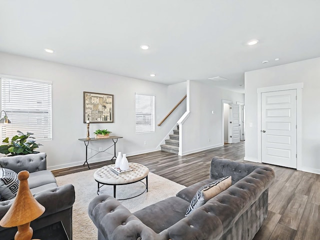 living room with dark hardwood / wood-style floors