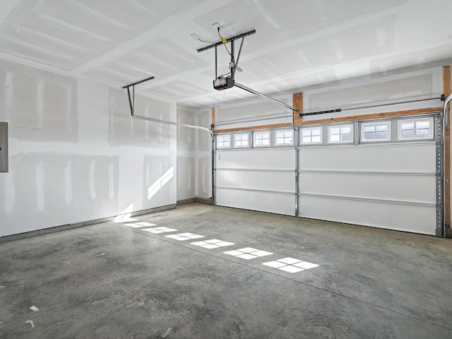 garage featuring a garage door opener and electric panel