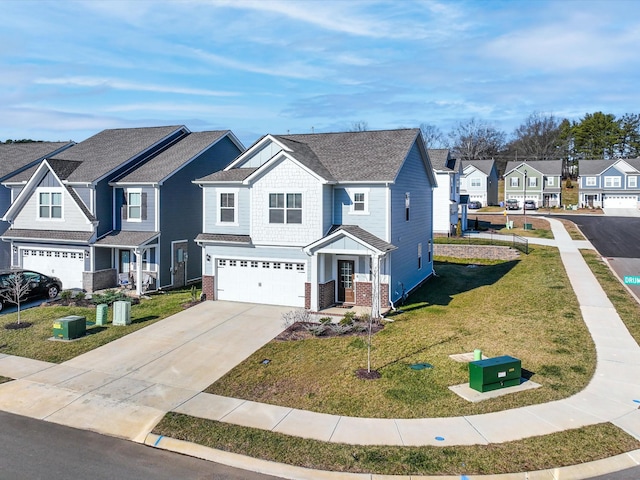 view of front of property featuring a garage and a front lawn