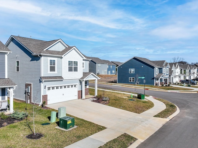 view of front of home featuring a garage and a front yard