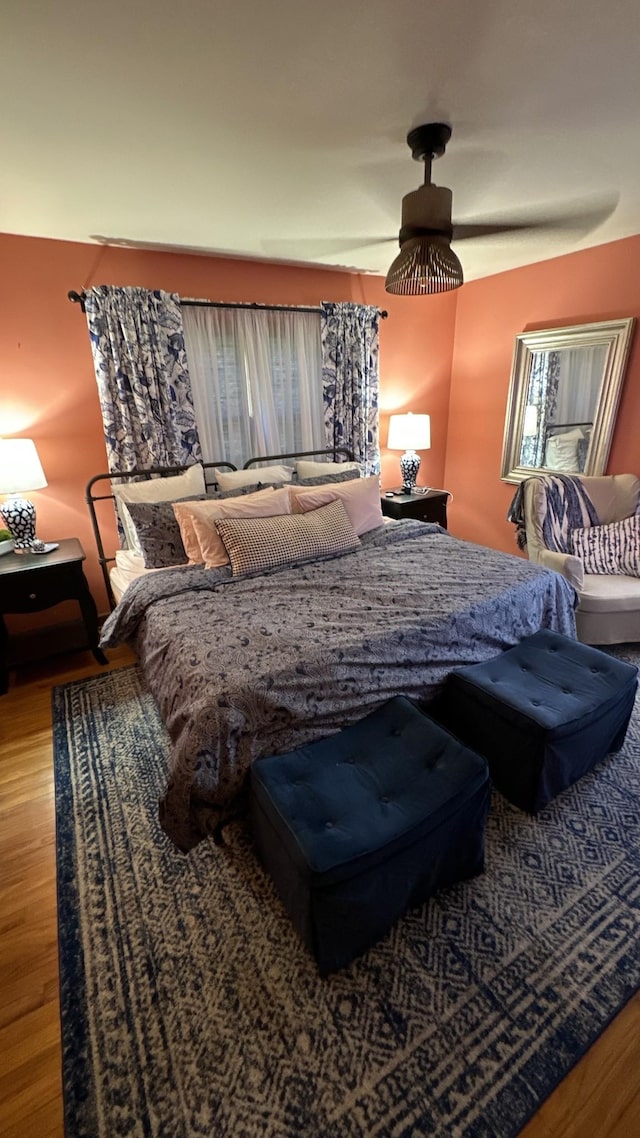 bedroom featuring ceiling fan and wood-type flooring