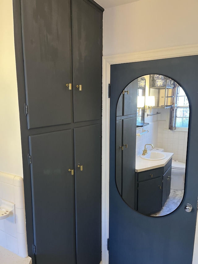 bathroom featuring toilet and vanity