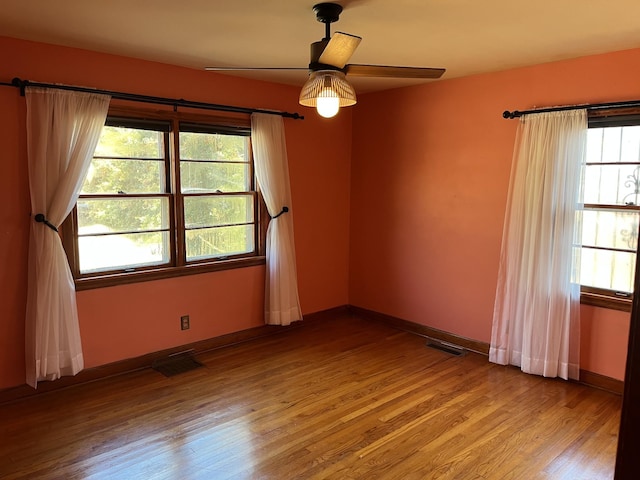 spare room featuring ceiling fan and light hardwood / wood-style floors