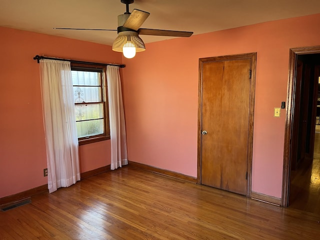 unfurnished bedroom featuring ceiling fan and light hardwood / wood-style floors