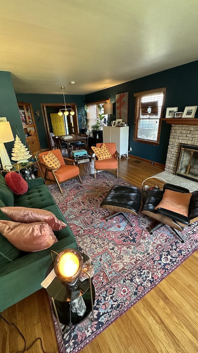 living room with a fireplace and hardwood / wood-style flooring