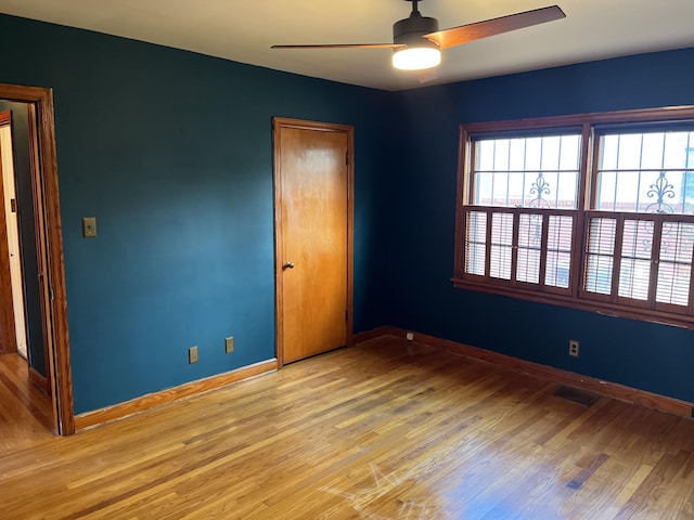 unfurnished bedroom featuring ceiling fan and light hardwood / wood-style floors