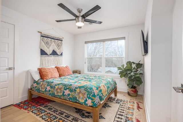 bedroom featuring hardwood / wood-style floors and ceiling fan