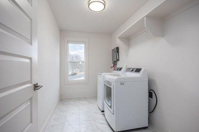 washroom with washing machine and clothes dryer