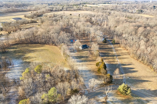 birds eye view of property with a rural view