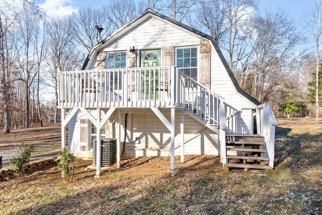 view of front of property with central AC unit and a garage