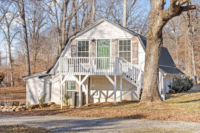 view of front of house with a garage and central AC