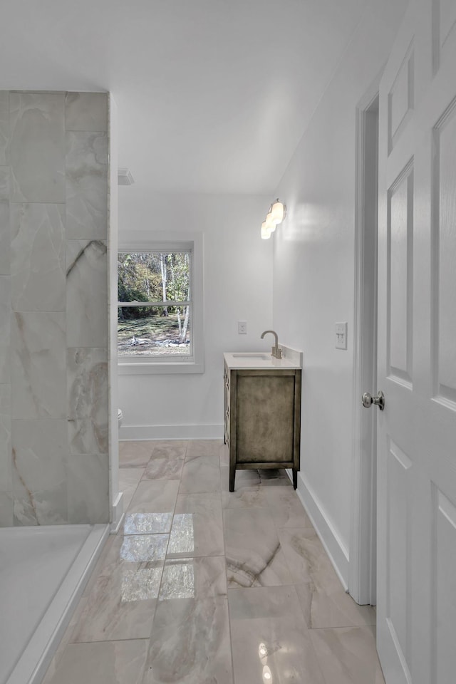 bathroom featuring walk in shower, vanity, and toilet