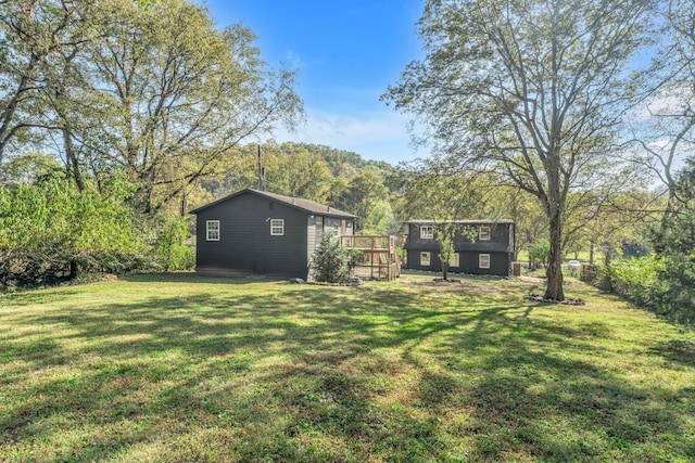 view of yard featuring a wooden deck