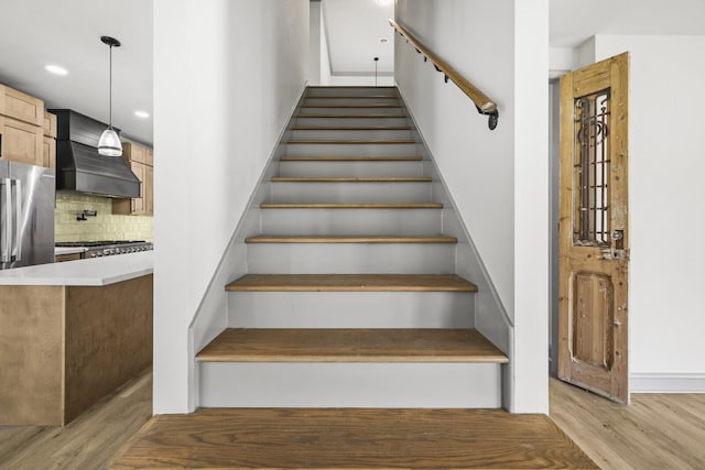 staircase featuring hardwood / wood-style flooring