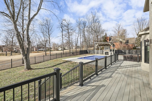 wooden deck featuring a covered pool