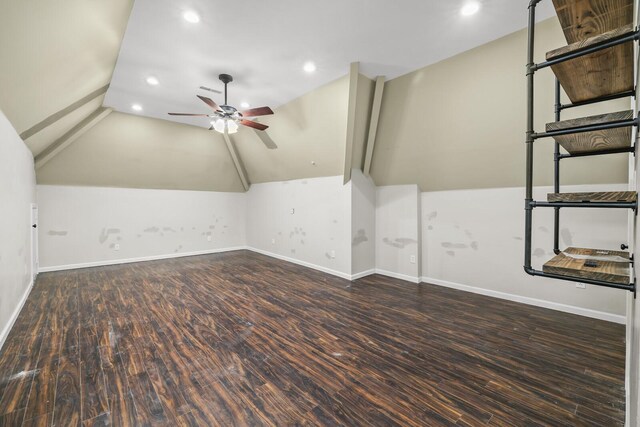 additional living space with lofted ceiling, dark wood-type flooring, and ceiling fan