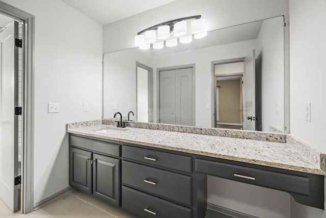 bathroom with tile patterned flooring and vanity