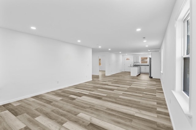 unfurnished living room featuring light hardwood / wood-style floors