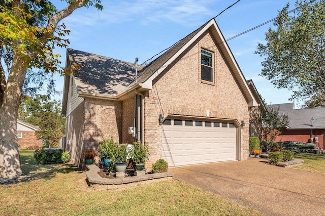 view of front of house with a front lawn and a garage