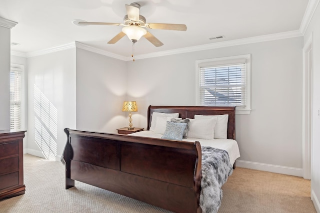 carpeted bedroom featuring ceiling fan and ornamental molding