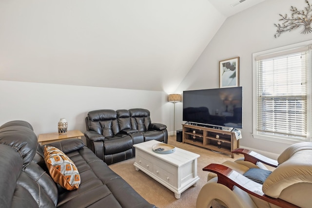 carpeted living room featuring vaulted ceiling